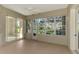 Sunroom with sliding glass doors and view of backyard at 2331 Harrier Way, Nokomis, FL 34275