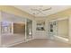 Bright sunroom with multiple sliding glass doors at 2331 Harrier Way, Nokomis, FL 34275