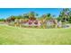 Landscaped pond with waterfall and tropical plants at 2331 Harrier Way, Nokomis, FL 34275