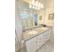 Bathroom with double vanity sinks and a stand up shower at 2501 Sherman Oak Dr, North Port, FL 34289