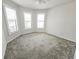 Bright bedroom with white walls, carpet and plantation shutters allows for lots of natural light at 2501 Sherman Oak Dr, North Port, FL 34289