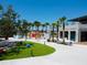 Well-maintained community area featuring unique seating, lush greenery, and pedestrian-friendly walkways at 2501 Sherman Oak Dr, North Port, FL 34289