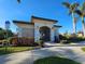 Community building with gated entrance and landscaping at 2501 Sherman Oak Dr, North Port, FL 34289