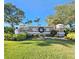 Welcoming entrance to the Cedar Grove community, featuring manicured landscaping and clear signage at 2501 Sherman Oak Dr, North Port, FL 34289