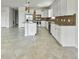 Well-lit kitchen featuring granite counters, stainless steel appliances, and white cabinetry at 2501 Sherman Oak Dr, North Port, FL 34289