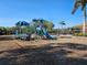 Colorful community playground with slides and swings under a sunny sky, perfect for Gathering fun at 2501 Sherman Oak Dr, North Port, FL 34289