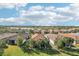 Aerial view of houses with lake views in a quiet community at 2572 Daisy Dr, North Port, FL 34289