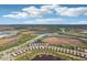 Community overview featuring various homes and natural landscape at 2572 Daisy Dr, North Port, FL 34289