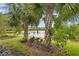 Landscaped backyard with pond and palm trees at 2572 Daisy Dr, North Port, FL 34289