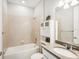 Clean bathroom with tub, shower, and vanity with a countertop at 2572 Daisy Dr, North Port, FL 34289