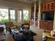 Relaxing community room with comfortable seating and bookshelves at 2572 Daisy Dr, North Port, FL 34289