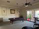 Community game room with a pool table and comfortable seating at 2572 Daisy Dr, North Port, FL 34289