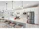 Spacious kitchen with white cabinets, stainless steel appliances, and granite countertops at 2572 Daisy Dr, North Port, FL 34289