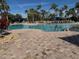Large resort-style pool with plenty of lounge chairs at 2572 Daisy Dr, North Port, FL 34289