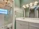 Well-lit bathroom features new countertop, sleek sink, and a glass-enclosed shower at 263 Southampton Dr # 301, Venice, FL 34293