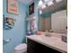 bathroom featuring light blue walls, white countertop, and playful decor at 263 Southampton Dr # 301, Venice, FL 34293