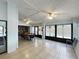 Community room with tables, chairs, and large windows overlooking the pool at 263 Southampton Dr # 301, Venice, FL 34293
