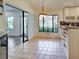 Bright dining area with custom cabinets and large windows with views of nature at 263 Southampton Dr # 301, Venice, FL 34293