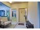 Welcoming entryway with a bench, coat rack, and frosted glass door at 263 Southampton Dr # 301, Venice, FL 34293