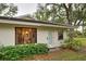 Exterior of a home with a large window showcasing the dining area at 263 Southampton Dr # 301, Venice, FL 34293