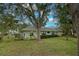 Exterior view of single-story home with tile roof and landscaped yard at 263 Southampton Dr # 301, Venice, FL 34293