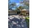 Charming single-story home with mature landscaping, an attached two-car garage and a curved driveway at 263 Southampton Dr # 301, Venice, FL 34293