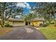 Charming single-story home with mature landscaping, an attached two-car garage and a curved driveway at 263 Southampton Dr # 301, Venice, FL 34293