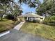Front view of a house with a welcoming walkway and landscaped yard at 263 Southampton Dr # 301, Venice, FL 34293