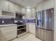 Well-equipped kitchen featuring stainless steel appliances and custom cabinets at 263 Southampton Dr # 301, Venice, FL 34293