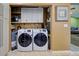 Laundry area with front-loading washer and dryer at 263 Southampton Dr # 301, Venice, FL 34293