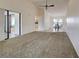 Spacious living room featuring high ceilings and ample natural light and neutral tones at 263 Southampton Dr # 301, Venice, FL 34293