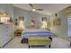 Bright main bedroom with king-size bed, ceiling fan, and elegant dresser at 263 Southampton Dr # 301, Venice, FL 34293