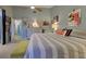 Inviting main bedroom with a king-size bed, ceiling fan, and ensuite bathroom at 263 Southampton Dr # 301, Venice, FL 34293