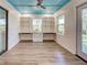 Office space with built-in shelving, a blue ceiling, and hardwood floors at 263 Southampton Dr # 301, Venice, FL 34293