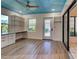 Well-lit home office includes built-in desk and shelves, complemented by wood floors and recessed lighting at 263 Southampton Dr # 301, Venice, FL 34293