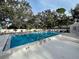 Community pool with ample space for lounging and swimming at 263 Southampton Dr # 301, Venice, FL 34293