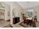 Elegant dining room with a wood table, mirror wall, and natural light at 2878 Egret Ct, North Port, FL 34287