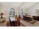 Formal dining room featuring a wood table and views to entry and living areas at 2878 Egret Ct, North Port, FL 34287