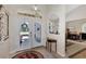 Bright entry with double doors, tile flooring, and views to the dining and living areas at 2878 Egret Ct, North Port, FL 34287