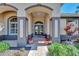 Front entry with arched doorways, tile flooring and potted plants at 2878 Egret Ct, North Port, FL 34287