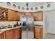 Kitchen features granite countertops, stainless steel appliances, and a wine rack at 2878 Egret Ct, North Port, FL 34287