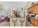 Modern kitchen features granite counters, stainless steel appliances, and an island at 2878 Egret Ct, North Port, FL 34287