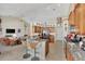 Open kitchen boasts granite counters, stainless steel appliances, and breakfast bar at 2878 Egret Ct, North Port, FL 34287