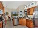 Kitchen with granite countertops, stainless steel appliances, and lake view at 2878 Egret Ct, North Port, FL 34287
