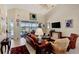 Comfortable living room with leather furniture and a beautiful view of the water at 2878 Egret Ct, North Port, FL 34287