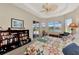 Main bedroom with built-in bookcase and water views at 2878 Egret Ct, North Port, FL 34287