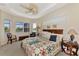 Spacious main bedroom with water views and a large bed at 2878 Egret Ct, North Port, FL 34287