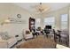 Bright office space with two armchairs, a desk, and built-in shelving at 2878 Egret Ct, North Port, FL 34287