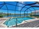 Relaxing pool and spa with lake views at 2878 Egret Ct, North Port, FL 34287