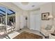 Sunroom with access to the pool area and outdoor seating at 2878 Egret Ct, North Port, FL 34287